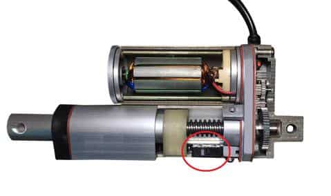 Cut-away view of a linear actuator showing built-in electro-mechanical limit switches at each end of travel